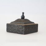 Vintage decorative box with a textured exterior and a lid